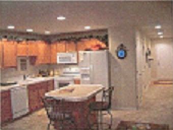 Open kitchen with island and tile countertops