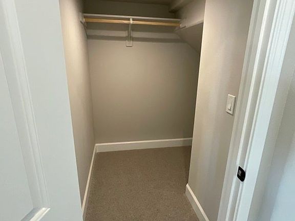 Generous entry closet under stairs for storage of larger items.