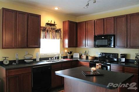 Nice cabinetry in kitchen with island.