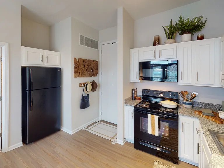 Cook and Entertain in a Modern Kitchen with Granite Countertops at Ralston Apartments