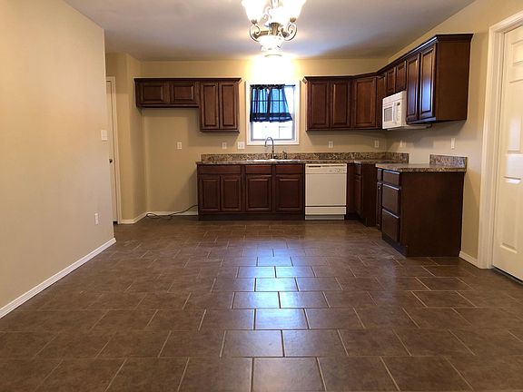 Din room/ kitchen 12_2_ w by 16_4_ long. Lots of storage plus pantry to left of photo