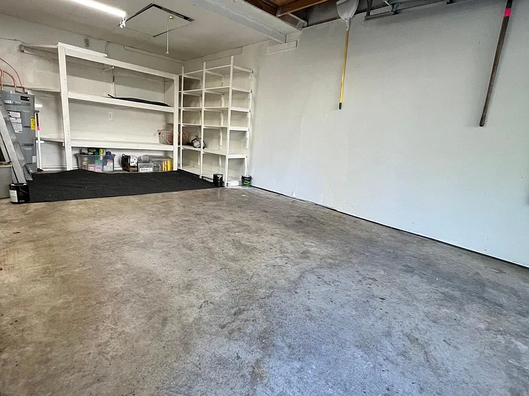 Lots of storage and work areas in the garage