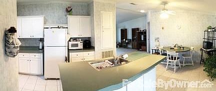 DINE-IN KITCHEN WITH LARGE CENTER ISLAND
						:
						Open floor plan featuring large dine-in kitchen, center island, and laundry area