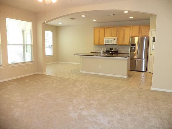 The kitchen area is open to the living room for those family gatherings or entertaining. Tile floor in kitchen and granite countertops. The refrigerator stays and the microwave to be replaced with a stainless one!