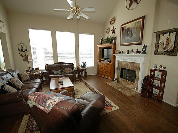 LIVING ROOM LOOKS OUT TO THE POOL
