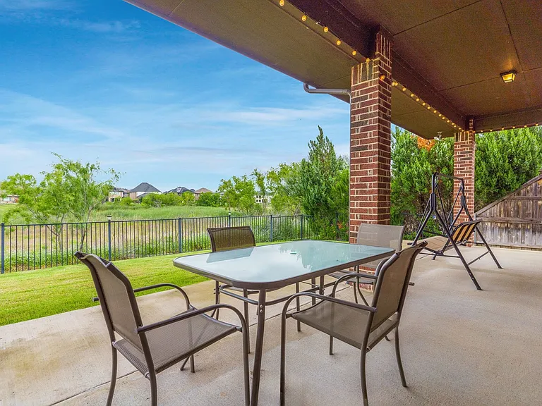 Your covered patio provides an ideal spot for morning coffee or a nightcap.