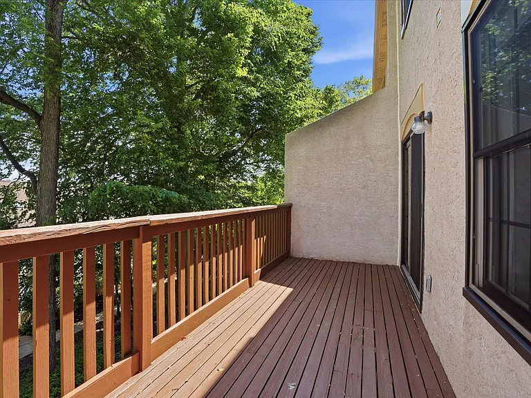 Serene balcony with lush green views.