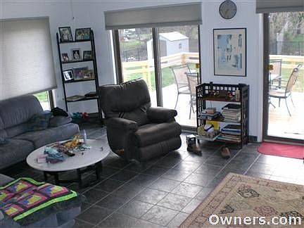 Open Family Room Leading to Designer Deck