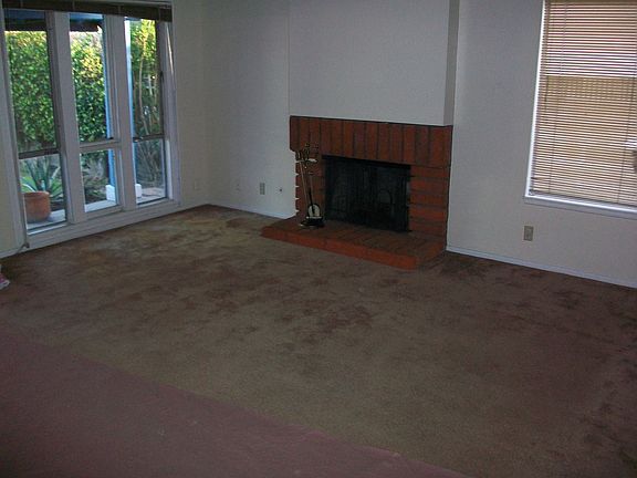 Living room, fireplace and vaulted ceiling