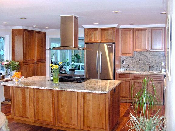 Custom cherry cabinetry & high-end grannite slab w/ soft sound of the koi pond