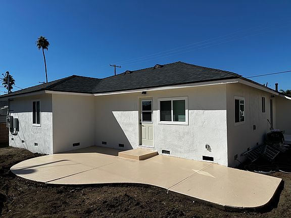 Backyard _
The patio is freshly painted with grip paint. No Grass, large yard.