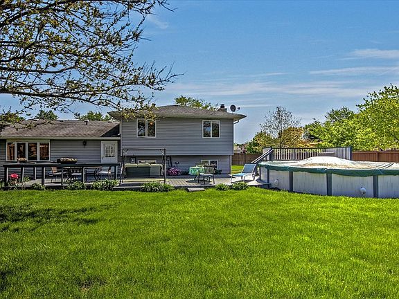 SPACIOUS FENCED YARD FEATURES 42X15' DECK PLUS 16X10' DECK AROUND THE POOL.