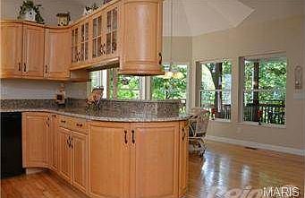 Notice the gazebo-style breakfast room overlooking wooded view.