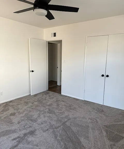 bedroom 2 all new ceiling fans in every bedroom and new carpet as well