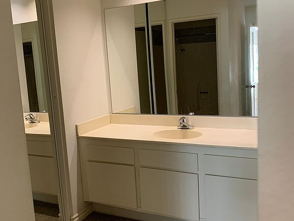 Dressing area with two spacious closets and mirror sliding doors