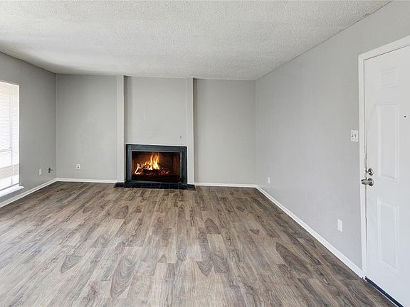 LIVING ROOM WITH WOOD-BURNING FIREPLACE