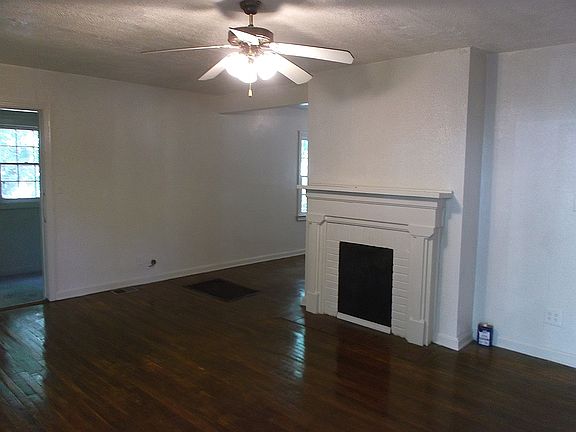 Looking to the left from front door enclosed porch, small room on the left