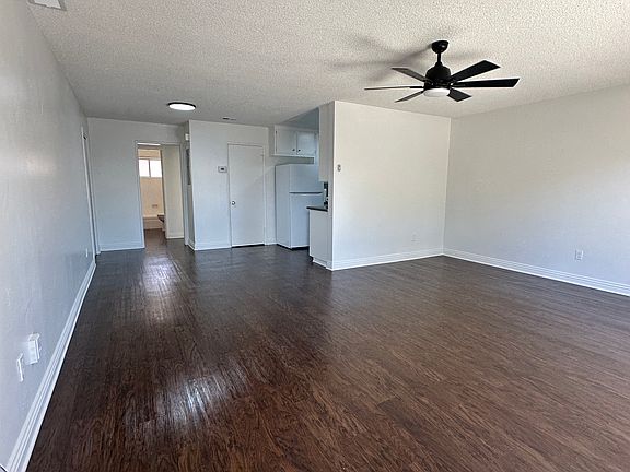 Family room. Brand new ceiling fan. Entire unit re-plumed, repainted and polished flooring.