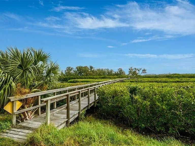 In Perico Bay Club, there are many landscaped walking and bike paths and many nature paths like this one.
