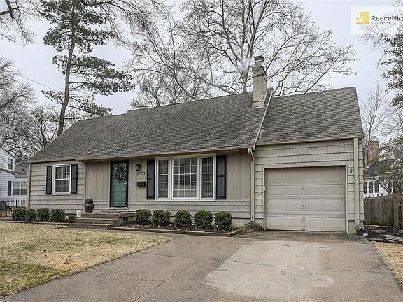Well-maintained Cape Cod with landscaping and curb appeal