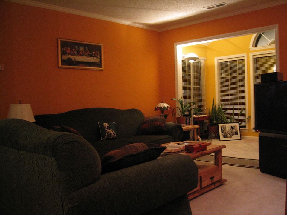 part of the living room looking toward the sunroom (being painted off-white)
