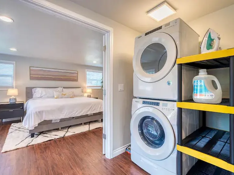 Designated laundry space right outside the primary bedroom