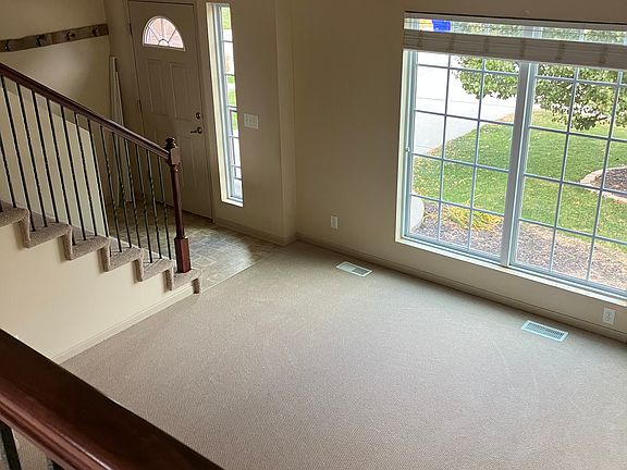 Living room and entrance from overlooking dining room