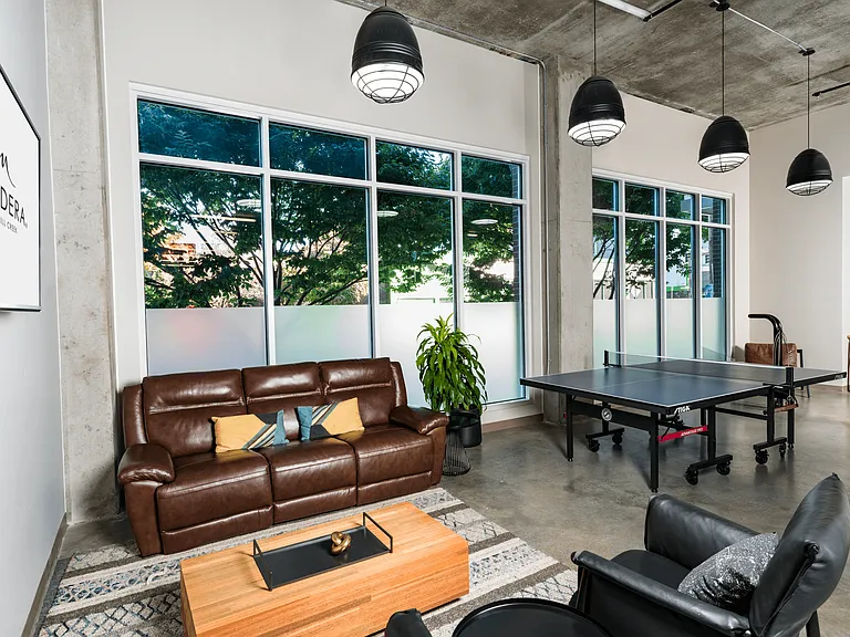 A laid-back game lounge at Modera Belmont, blending casual seating and ping pong, just moments from Belmont's cafes, shops, and local favorites.