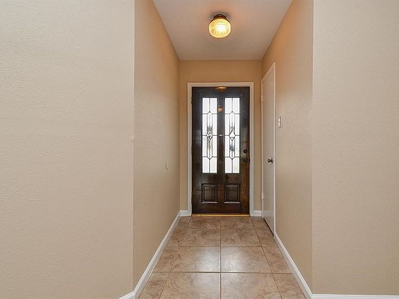 Entry with a coat closet.