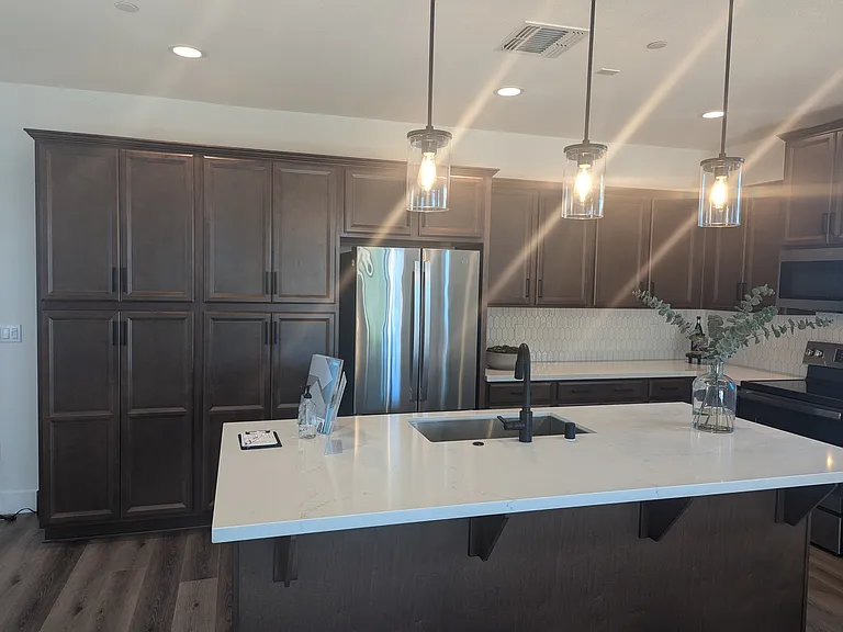 Kitchen Island.
Actual home will have dark granite.