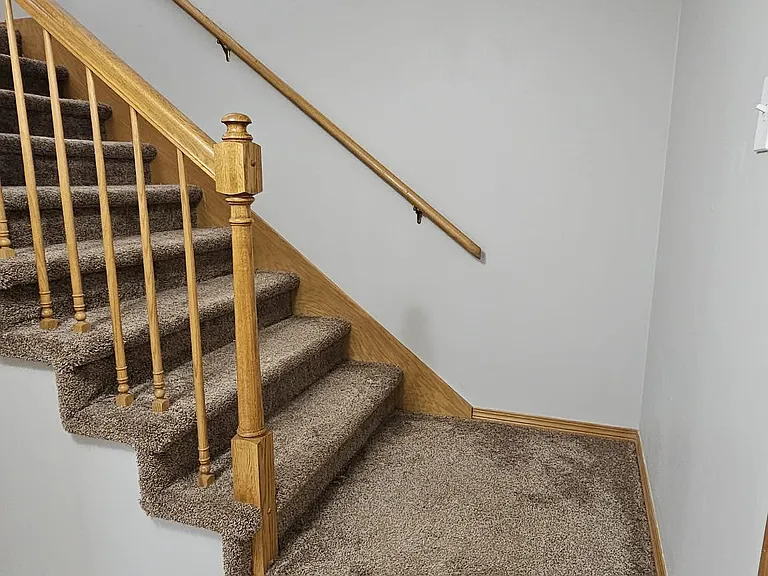 stairs up to top level by the front door