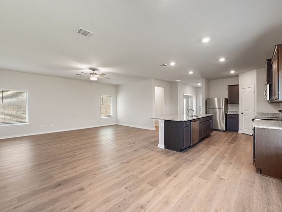 The living room sits right off of the kitchen and dining room.