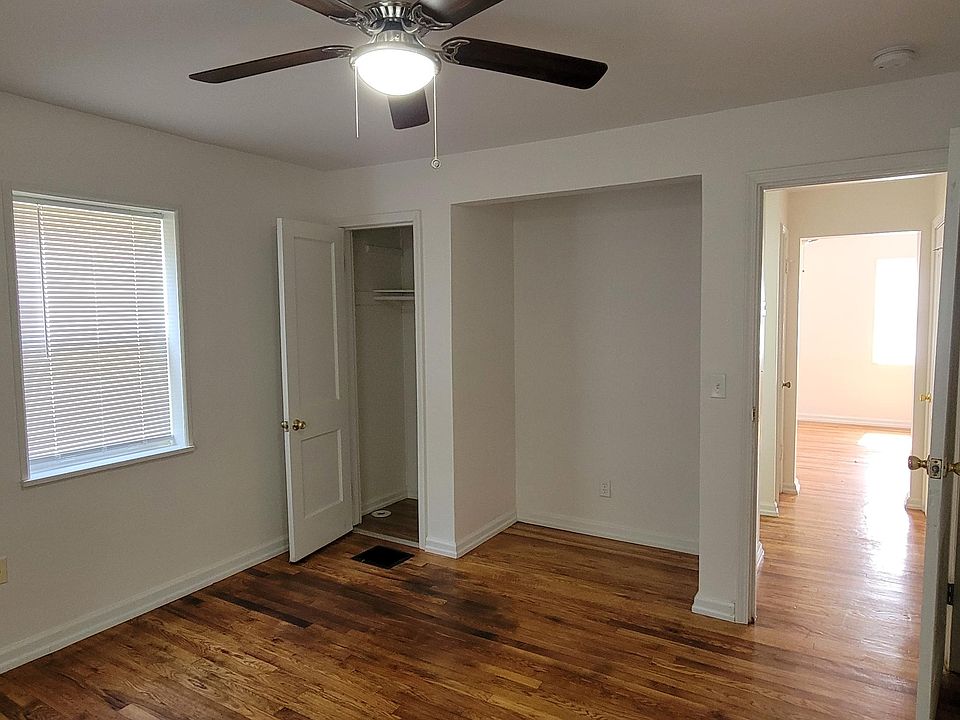 Bedroom with ceiling fan for cooling, along with closet and extra space for storage