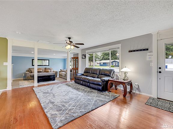 The living room opens up to a sunken in bonus room!