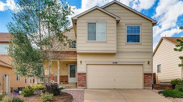 Curb appeal greets you as you drive up to 5548 Prairie Schooner