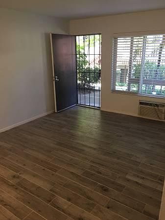 Looking from living room towards front door. Brand new floor