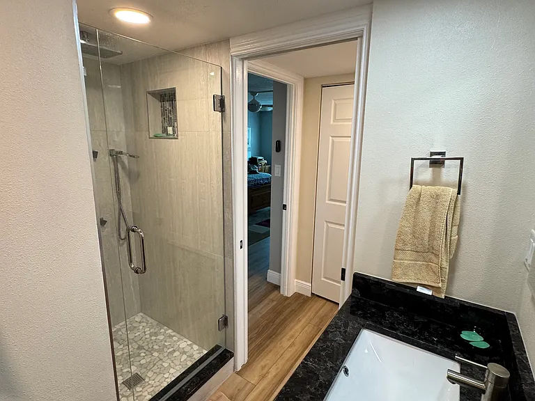 Guest bathroom with rain shower and body jets