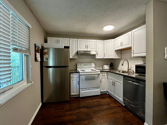 Renovated kitchen, well-equipped with new appliances- fridge, dishwasher, microwave, toaster, blender, coffee maker, dinnerware & utensils.