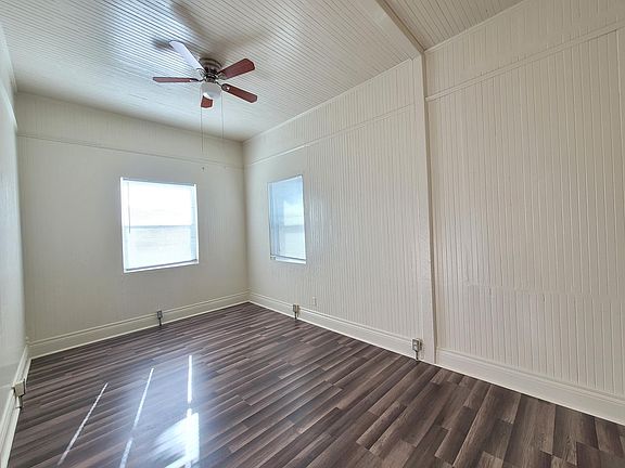 separate living/ family room with ceiling fan naturally lit/ bright