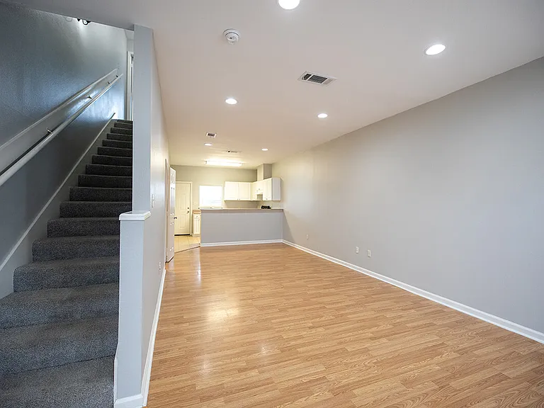 4439-BROWN-STREET-living-kitchen-stairs_01272026