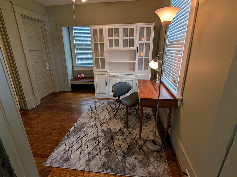 Walk-in closet, study area, and window nook.