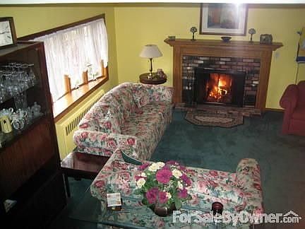 Cold outside? Cozy up by the warm, glowing fireplace in the Living Room