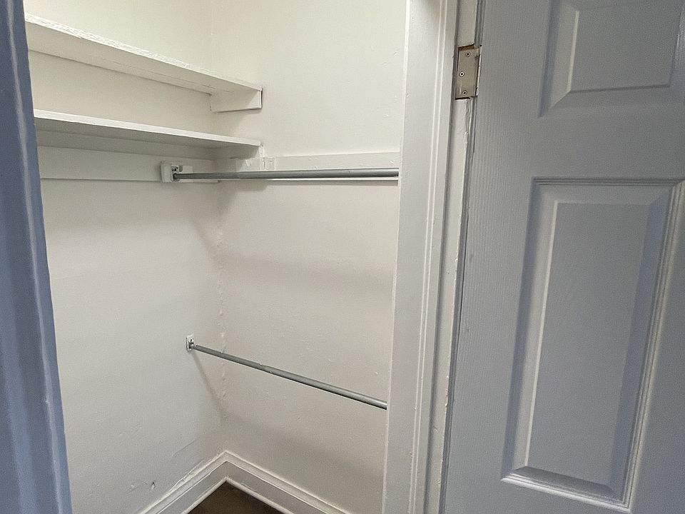 walk-in closet in bedroom with lots of shelving