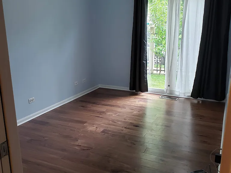 2nd bedroom with new floors and paint