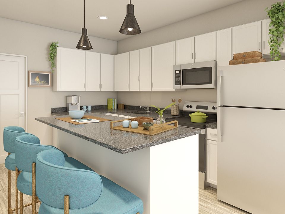 Greenwood Commons apartment kitchen showing countertops, cabinets, and appliances.