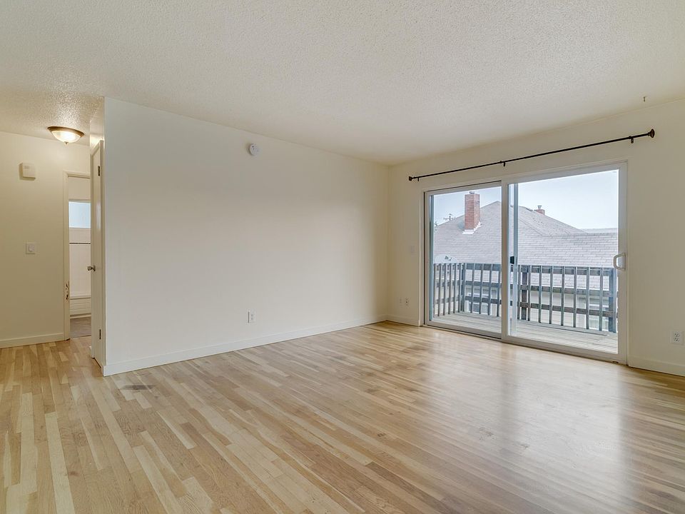 Living room with sliding glass doors to private deck