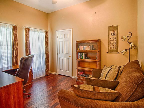 The study is near the entry door and offers a ceiling fan, storage closet, and this spectacular hand