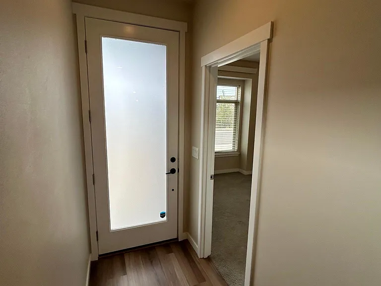 Front door hallway showing entrance to front bedroom