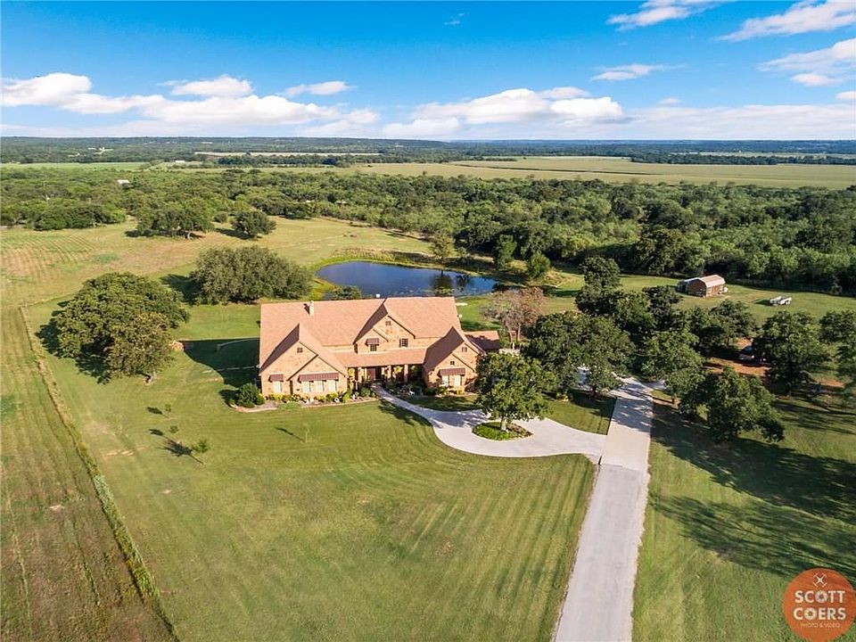 Welcome home! An exclusive gate community. Home is situated on 6.144 acers, large oak trees and a pond.