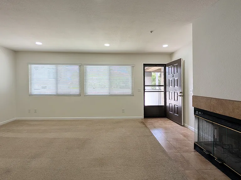 View of balcony and trees from living room
